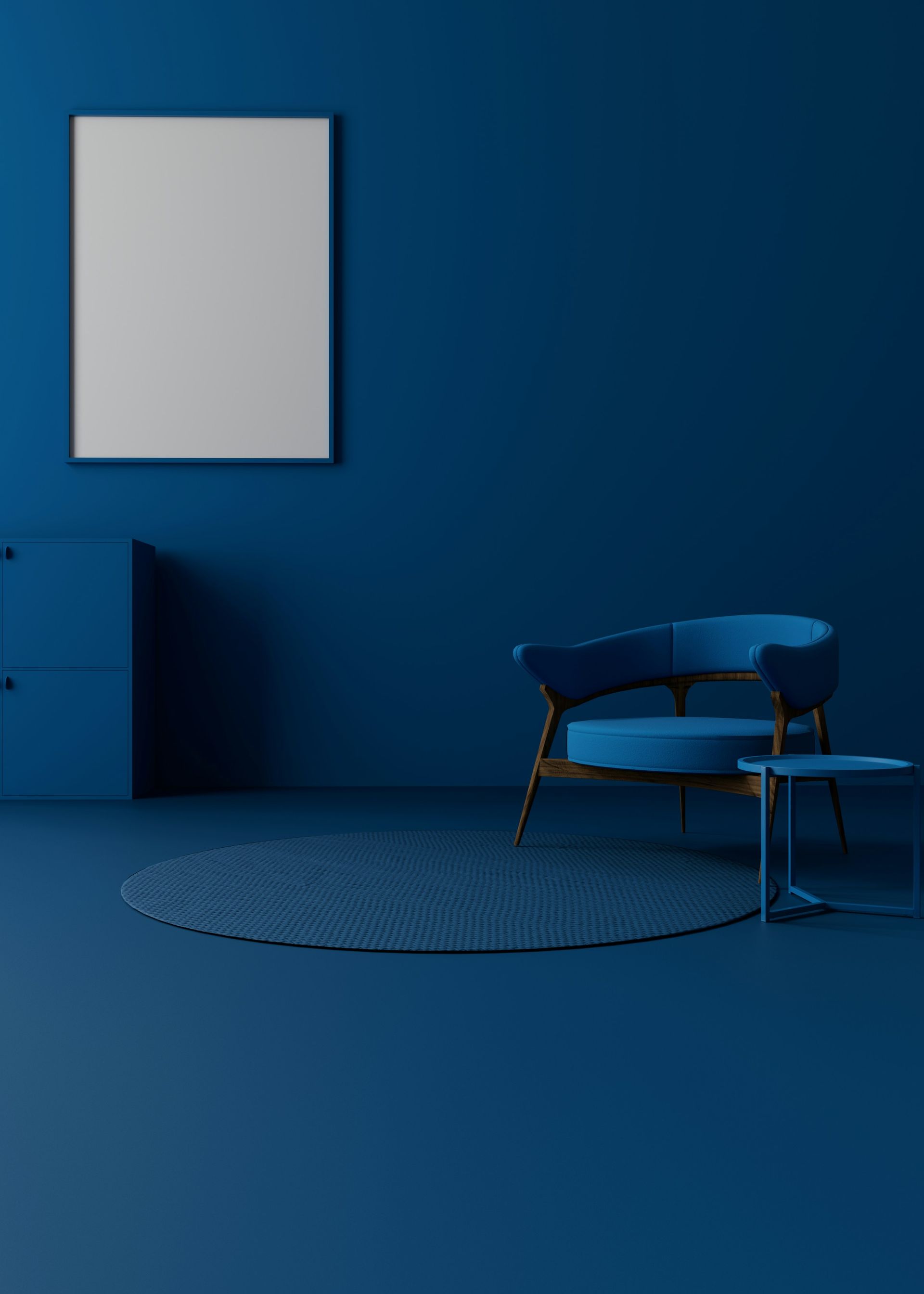 A blue room with a chair and a picture frame